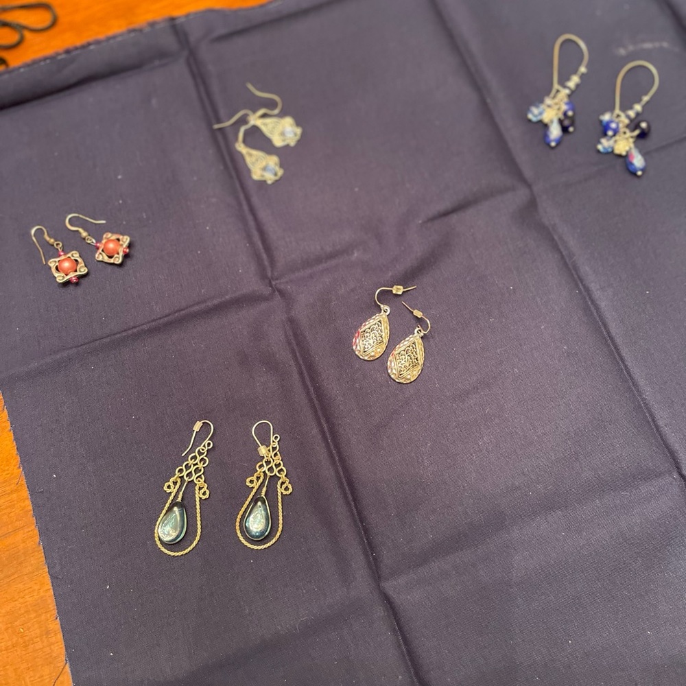 Four pairs various hanging earrings unique colors and designs